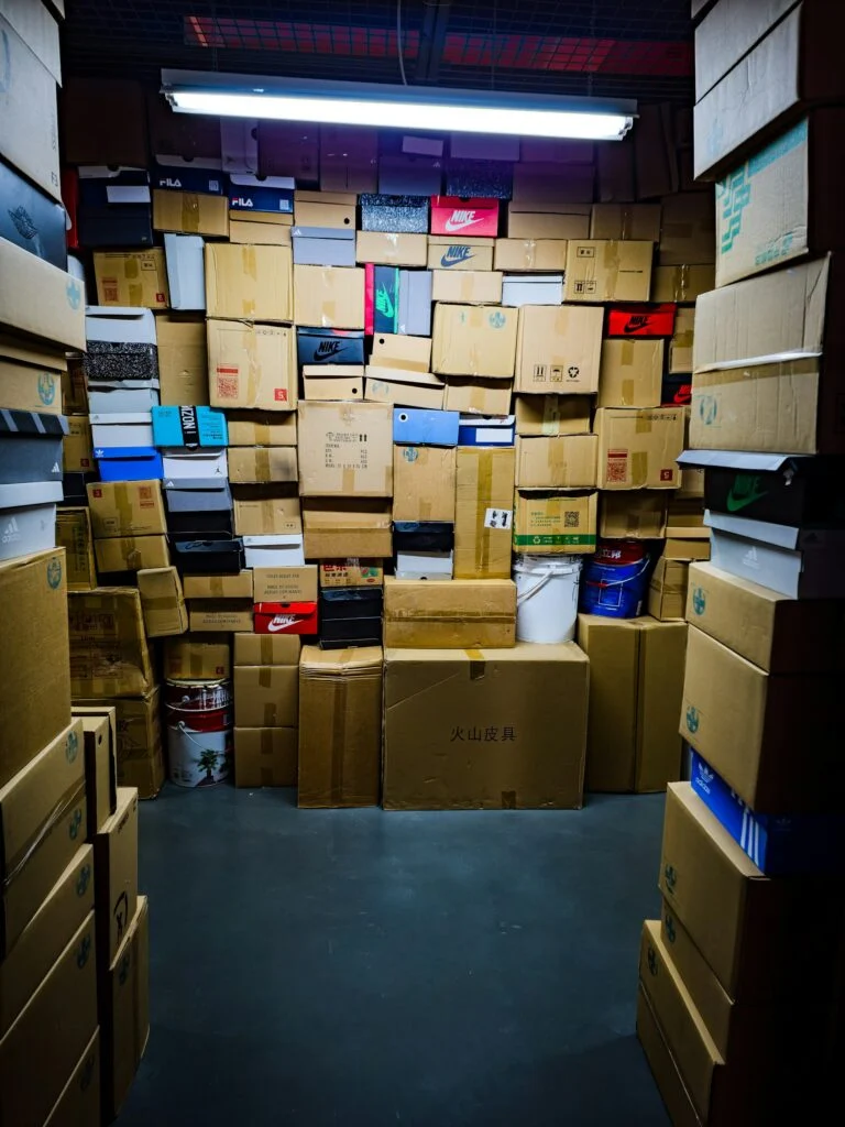 Room filled with stacked moving boxes